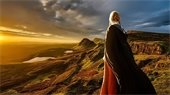 Ireland - sunset - landscape - woman in traditional Irish dress