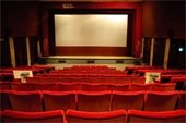 Picture of movie theatre with red seats