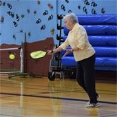 Pickleball player serving