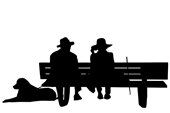 Silhouette of older couple on bench