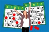 woman - hands raised - two Bingo cards