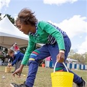Child picking up eggs