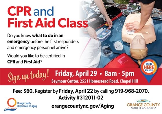 CPR & First Aid Class - hands giving CPR to training dummy - first aid equipment