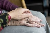 elderly hands - caregiver hands