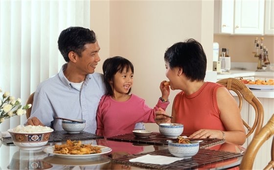 Image of masked protesters with fists in the air.