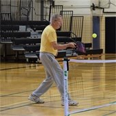Pickleball player at the net