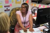 Orange County Department of Social Services, Social Worker, Keisha Andrews, MSW, in her office counseling a client.