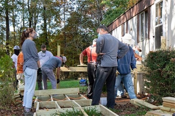 Photo of people building a ramp