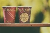 two "to go" coffee cups