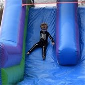 Child on inflatable slide