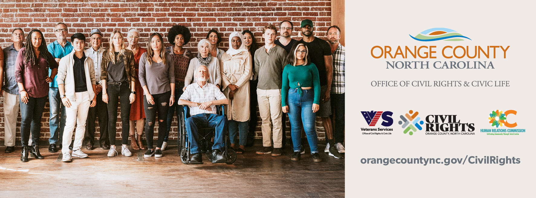 Diverse group of people standing together next to Orange County NC Civil Rights & Civic Life logos a