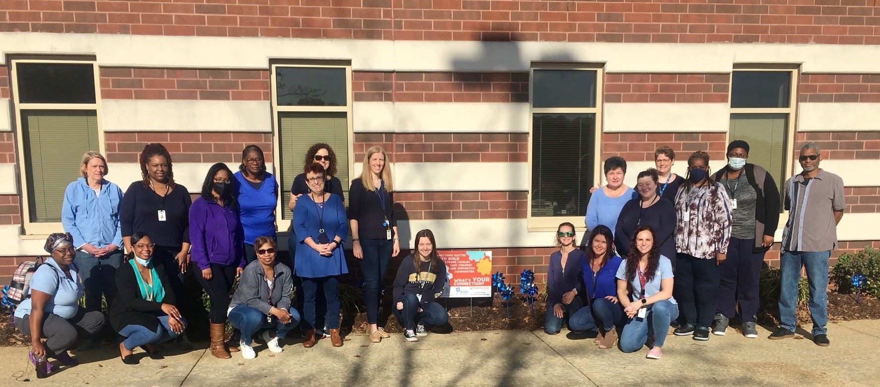 Photo of DSS employees in front of Pinwheels