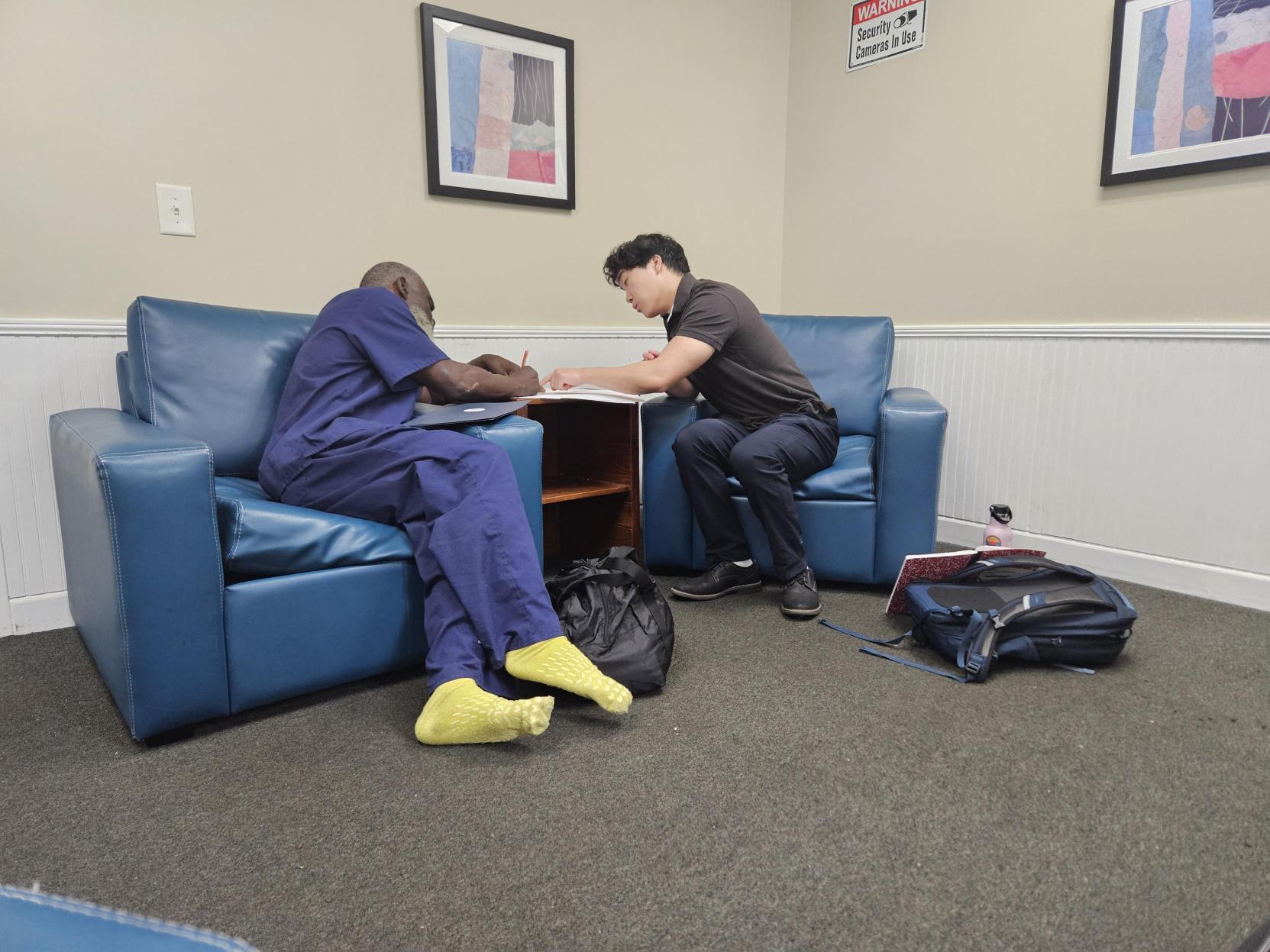 Intern and LRC participant filling out paperwork