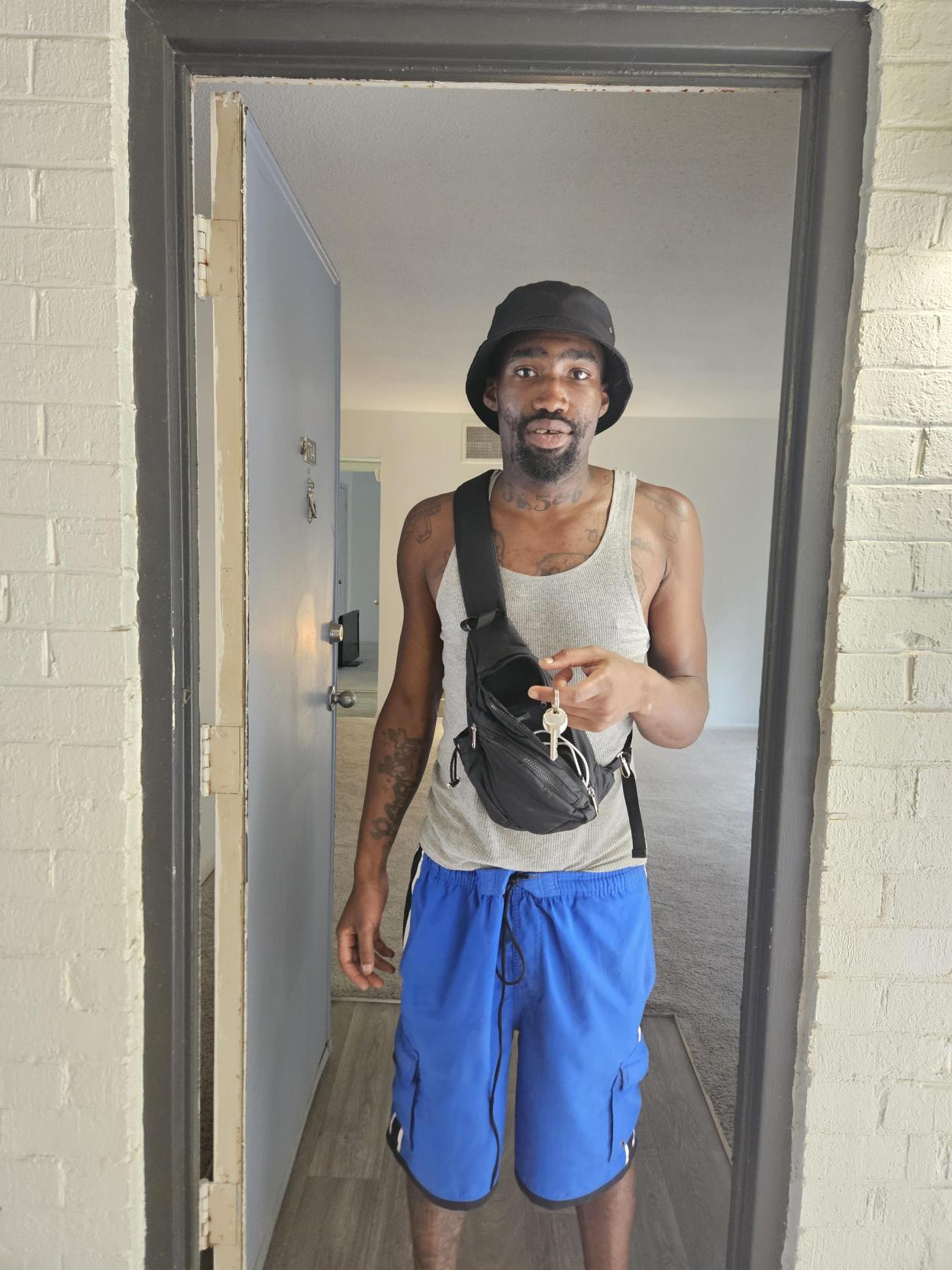 Anthony, LRC participant holding keys to new apartment